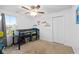 Carpeted bedroom featuring a ceiling fan, a built-in loft bed, and large window at 13820 N Cardonia Dr, Camby, IN 46113