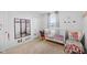 ' bedroom featuring a white crib, rocking chair, and carpeted floors, perfect for a Bedroom at 13820 N Cardonia Dr, Camby, IN 46113