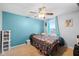 Bright bedroom with large windows, neutral carpet, and a ceiling fan at 13820 N Cardonia Dr, Camby, IN 46113