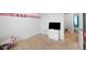 Empty bedroom with a white dresser, carpeted floors, a ceiling fan, and view into an adjacent room at 13820 N Cardonia Dr, Camby, IN 46113