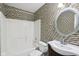 Modern bathroom featuring tiled walls and floor with shower over tub at 13847 Wabash Dr, Fishers, IN 46038
