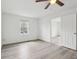 Bright bedroom with white walls, hardwood floor, and a window at 13847 Wabash Dr, Fishers, IN 46038