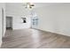 Spacious, bright room features durable flooring, vaulted ceiling, and pass-through to the kitchen and front entry at 13847 Wabash Dr, Fishers, IN 46038