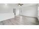 Open loft area with hardwood floors and ample natural light from the windows at 13847 Wabash Dr, Fishers, IN 46038