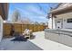 Relaxing back yard patio area, including a hot tub, privacy fence, and comfortable seating area at 1403 Fletcher Ave, Indianapolis, IN 46203