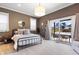 Bedroom featuring large windows, neutral colors and direct access to an outdoor deck at 1403 Fletcher Ave, Indianapolis, IN 46203