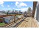 Outdoor deck featuring wood flooring and views of the neighborhood on a sunny day at 1403 Fletcher Ave, Indianapolis, IN 46203