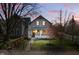 Charming two-story home with front porch and fenced yard on a lovely tree-lined street at 1403 Fletcher Ave, Indianapolis, IN 46203