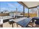 Cozy outdoor patio featuring ample seating, dining area, and a relaxing hot tub at 1403 Fletcher Ave, Indianapolis, IN 46203
