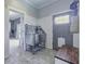 Convenient pet washing station with stainless steel tub and tile floor near entryway at 1403 Fletcher Ave, Indianapolis, IN 46203