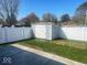 Fenced-in backyard featuring a storage shed on a well maintained lawn with a concrete patio at 1468 Lexington Trl, Greenfield, IN 46140