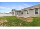 Lush backyard showcasing a concrete patio, green lawn, and a well-maintained exterior at 1468 Lexington Trl, Greenfield, IN 46140