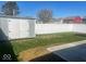 View of the backyard featuring a utility shed and full vinyl privacy fence at 1468 Lexington Trl, Greenfield, IN 46140