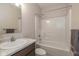 Clean bathroom features a tub and shower combo, marble countertop, and modern sink at 1468 Lexington Trl, Greenfield, IN 46140