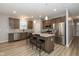 Modern kitchen with stainless steel appliances, granite countertops, breakfast bar, and pendant lighting at 1468 Lexington Trl, Greenfield, IN 46140