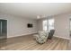 Bright living room featuring wood floors, recessed lighting, and comfortable seating with large windows at 1468 Lexington Trl, Greenfield, IN 46140