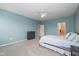 Comfortable main bedroom features large windows, a ceiling fan, and ensuite bathroom at 1468 Lexington Trl, Greenfield, IN 46140