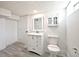 Bathroom featuring a modern vanity, framed mirror and neutral walls and vinyl floor at 1511 E Tabor St, Indianapolis, IN 46203