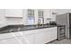 Renovated kitchen featuring stainless steel appliances, updated cabinets, and modern sink at 1511 E Tabor St, Indianapolis, IN 46203