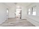 Bright and airy living room featuring wood floors, fresh white paint, and a window bench at 1511 E Tabor St, Indianapolis, IN 46203