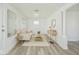 Bright living room featuring new laminate flooring, white walls, and modern furniture at 1511 E Tabor St, Indianapolis, IN 46203