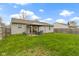 Spacious backyard features well-manicured lawn with a patio set, gazebo and fenced perimeter at 1517 Citation N Cir, Lebanon, IN 46052