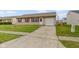 This charming home is complemented by a spacious concrete driveway, offering plenty of parking space at 1517 Citation N Cir, Lebanon, IN 46052