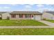 Charming single-story home featuring a well-maintained front lawn and an attached one-car garage at 1517 Citation N Cir, Lebanon, IN 46052