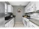 The kitchen features a dual-basin sink, decorative items, and ample counter space at 1517 Citation N Cir, Lebanon, IN 46052