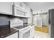 The kitchen showcases a range, overhead microwave, and white cabinetry at 1517 Citation N Cir, Lebanon, IN 46052