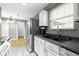 An alternate view of the kitchen space showing the stainless steel refrigerator and sink area at 1517 Citation N Cir, Lebanon, IN 46052