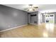 Spacious, open-concept living room featuring hardwood floors and neutral gray paint at 1517 Citation N Cir, Lebanon, IN 46052