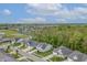 An aerial view shows a neighborhood, golf course, and ponds at 16422 Brigham Ln, Westfield, IN 46074