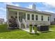 A covered patio, seating, and greenery highlight this backyard at 16422 Brigham Ln, Westfield, IN 46074