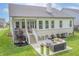Spacious backyard with a patio, outdoor seating, and lush green lawn at 16422 Brigham Ln, Westfield, IN 46074
