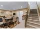 Finished basement with dining area, stairs, and neutral decor at 16422 Brigham Ln, Westfield, IN 46074
