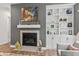 Modern fireplace with stylish mantle and built-in shelves for a cozy living space at 16422 Brigham Ln, Westfield, IN 46074