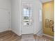 Bright foyer with a glass-paneled front door and a view of the neighborhood at 16422 Brigham Ln, Westfield, IN 46074