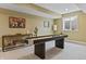 Basement game room featuring a shuffleboard table and stylish decor at 16422 Brigham Ln, Westfield, IN 46074