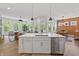 Modern kitchen with a large island, stainless steel appliances, and open-concept design at 16422 Brigham Ln, Westfield, IN 46074