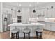 Well-lit kitchen featuring stainless steel appliances, center island and bar stool seating at 16422 Brigham Ln, Westfield, IN 46074
