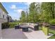 An inviting patio offers ample seating and a fire pit at 16422 Brigham Ln, Westfield, IN 46074