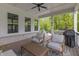 Charming covered porch with a ceiling fan and comfortable outdoor seating at 16422 Brigham Ln, Westfield, IN 46074