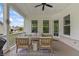 Cozy covered porch with comfortable seating and views of the quiet neighborhood at 16422 Brigham Ln, Westfield, IN 46074