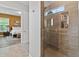 Modern shower with tile surround, built-in niche, and views to Primary bedroom at 16422 Brigham Ln, Westfield, IN 46074