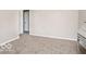 Small bedroom featuring neutral decor, carpet, and doorways to other rooms at 1734 Bittersweet Dr, Anderson, IN 46011
