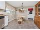 Cozy kitchen featuring a breakfast nook with table, chairs, and vintage hutch at 1734 Bittersweet Dr, Anderson, IN 46011
