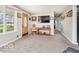 Spacious living room with large window, plush carpeting, and easy access to the home's entrance at 1734 Bittersweet Dr, Anderson, IN 46011