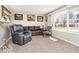 Comfortable living room with a large window, plush carpeting, and a cozy seating arrangement, perfect for relaxation at 1734 Bittersweet Dr, Anderson, IN 46011