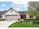 A view of the home's exterior and manicured landscape, with a well-maintained lawn and driveway at 18009 Sun Ridge Cir, Noblesville, IN 46062